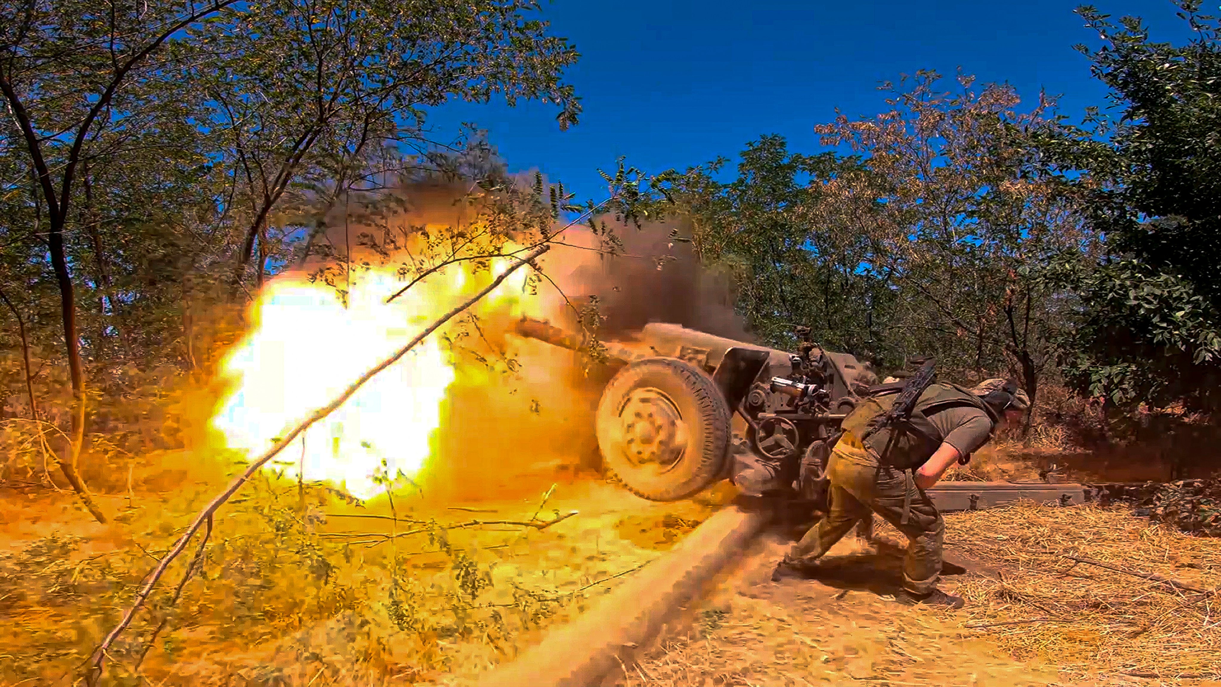 A Russian soldier fires from D-30 howitzer towards Ukrainian positions in an undisclosed location in Ukraine. Photo: Russian Defence Ministry Press Service via AP