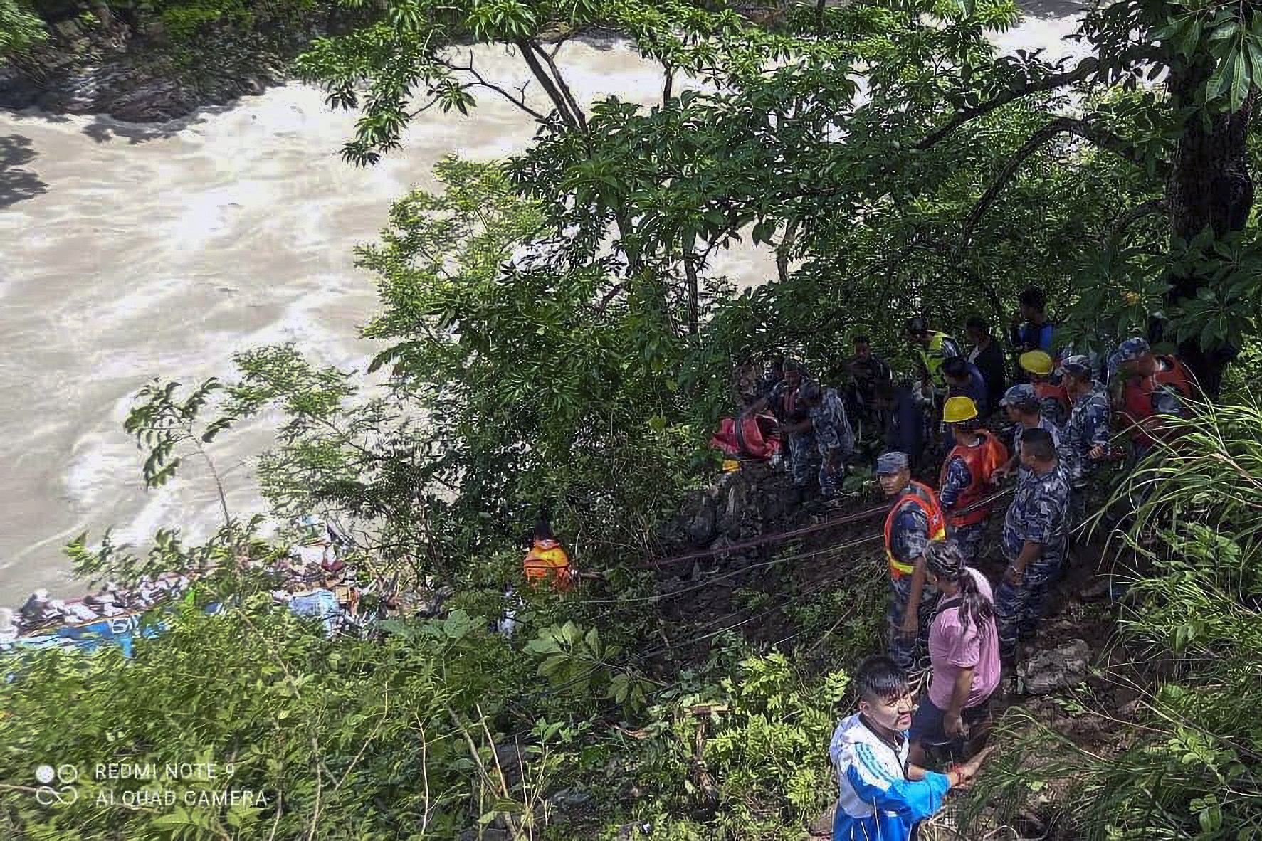 The rescue operation after a bus carrying Indian pilgrims fell into a river near Nepal’s Abukhaireni town. Photo: AP