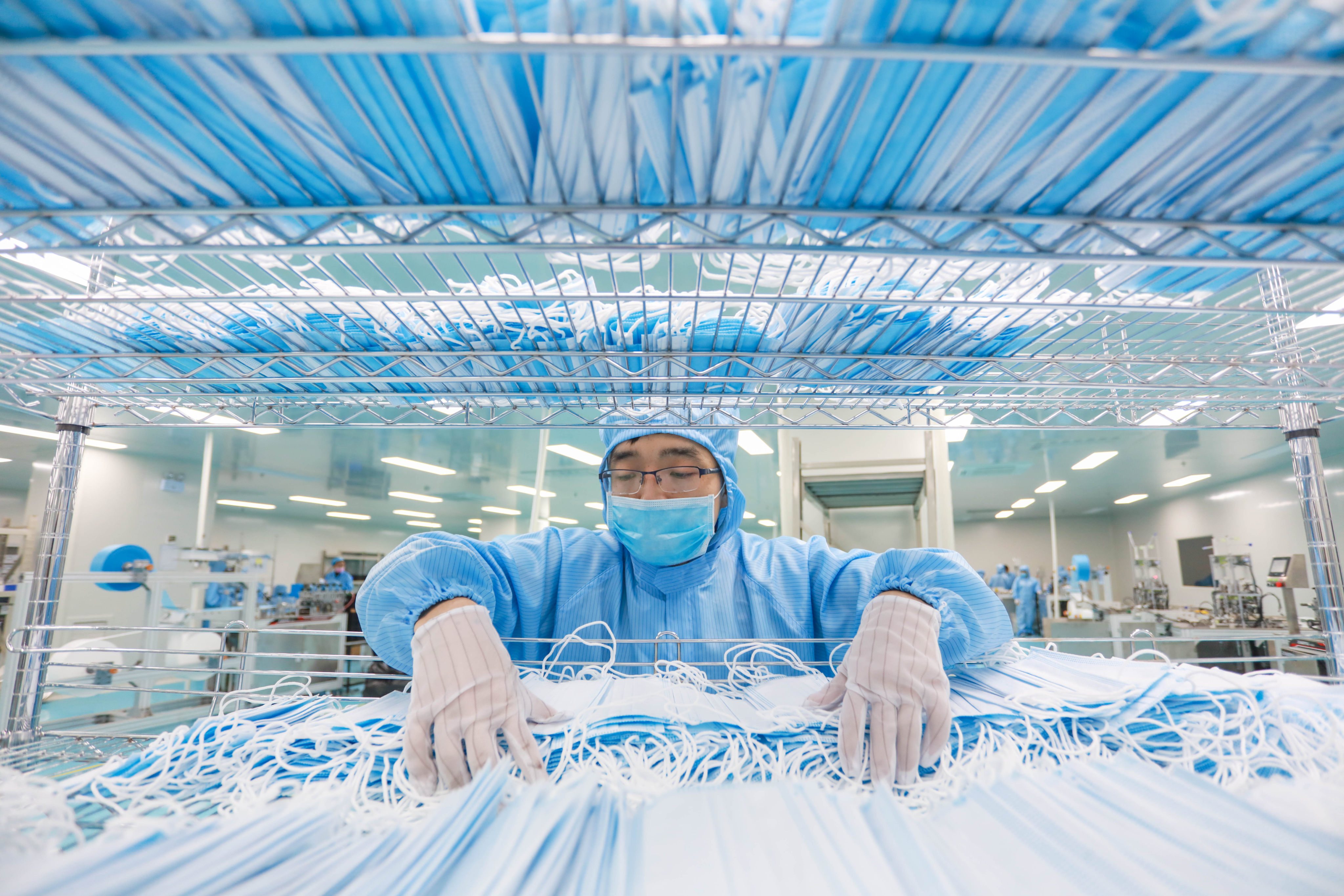 A staff member arranges masks at a medical equipment company in Suining, southwest China’s Sichuan province. Photo: Xinhua