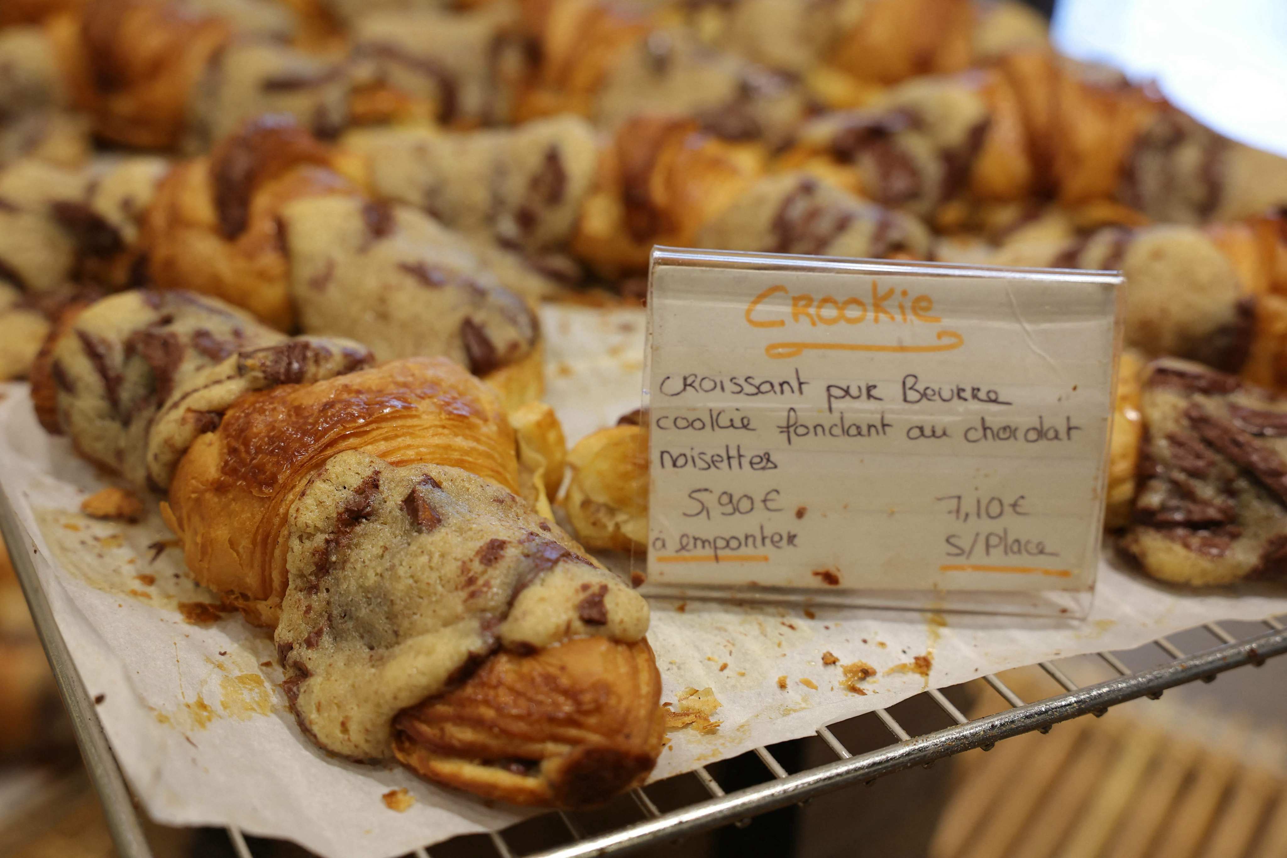 Crookies, a traditional French croissant mixed with cookie dough, in the pastry shop of French pastry chef Stephane Louvard in Paris, who is credited with inventing them. Along with the croffle and flat croissant, they have become trendy alternatives to the croissant. Photo: AFP